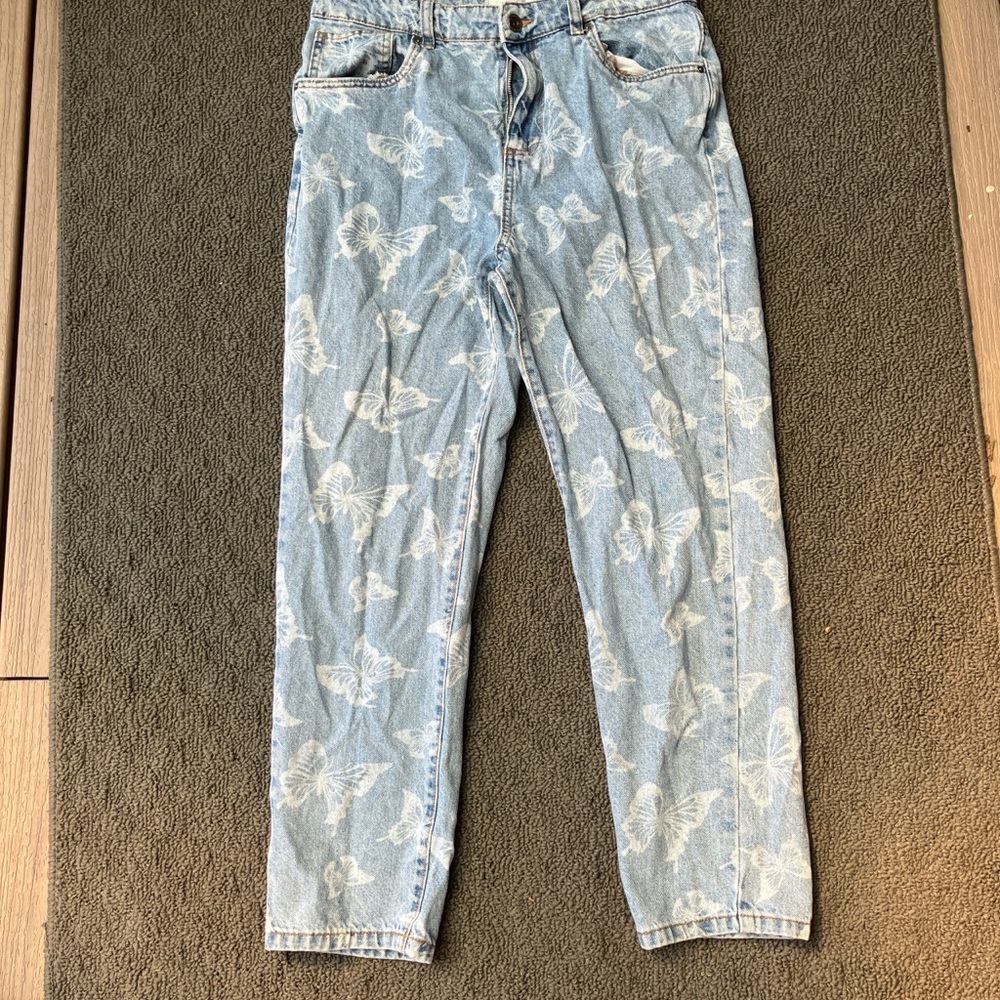 Blue jeans with white butterfly’s